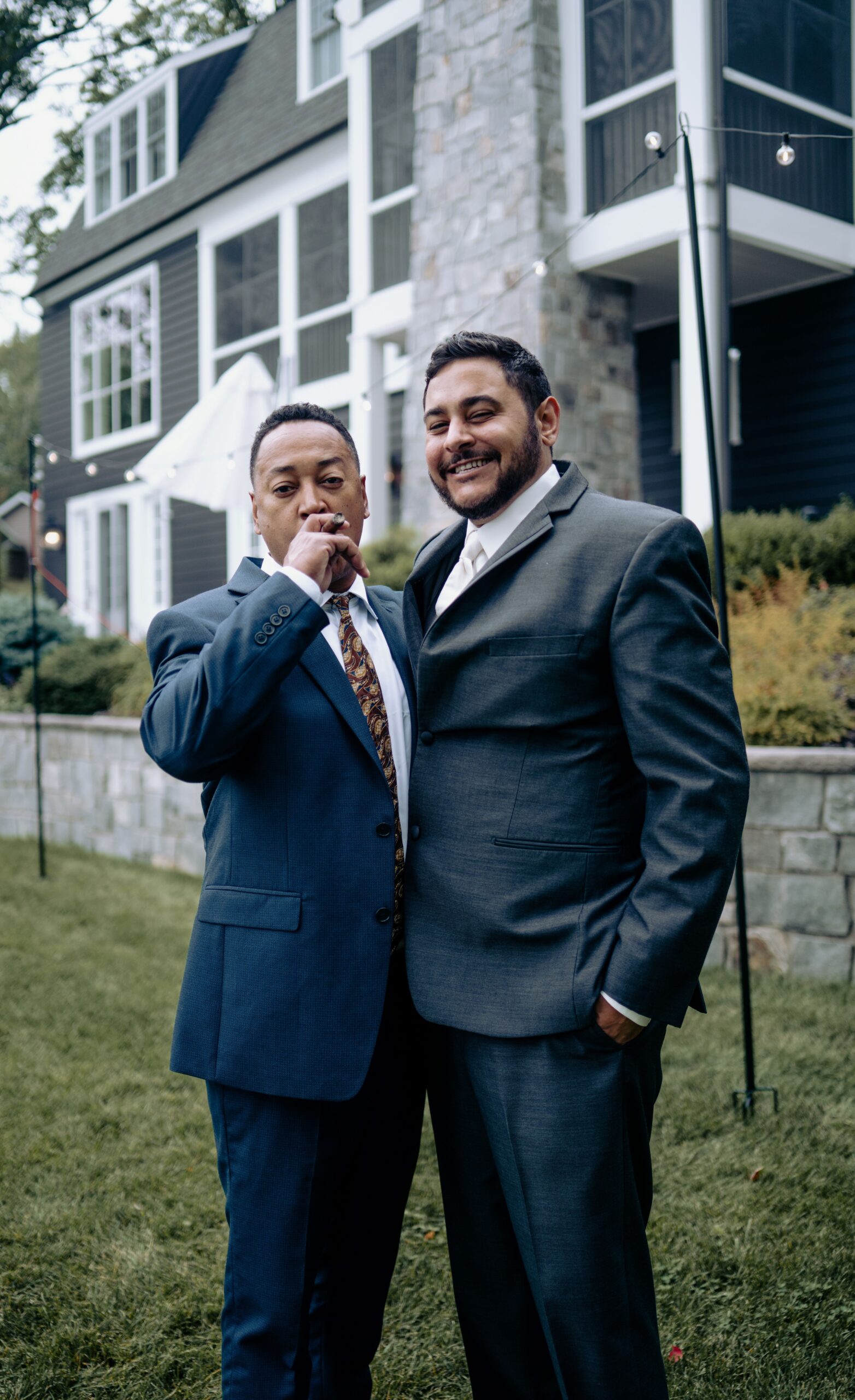 Bridal party cheering outside lakeside venue